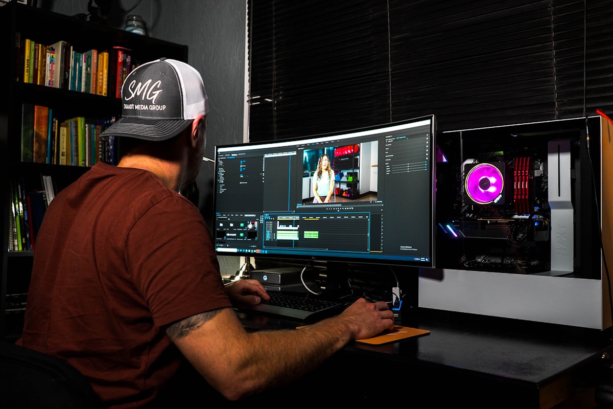 Video editing suite with timeline and colour grading monitors